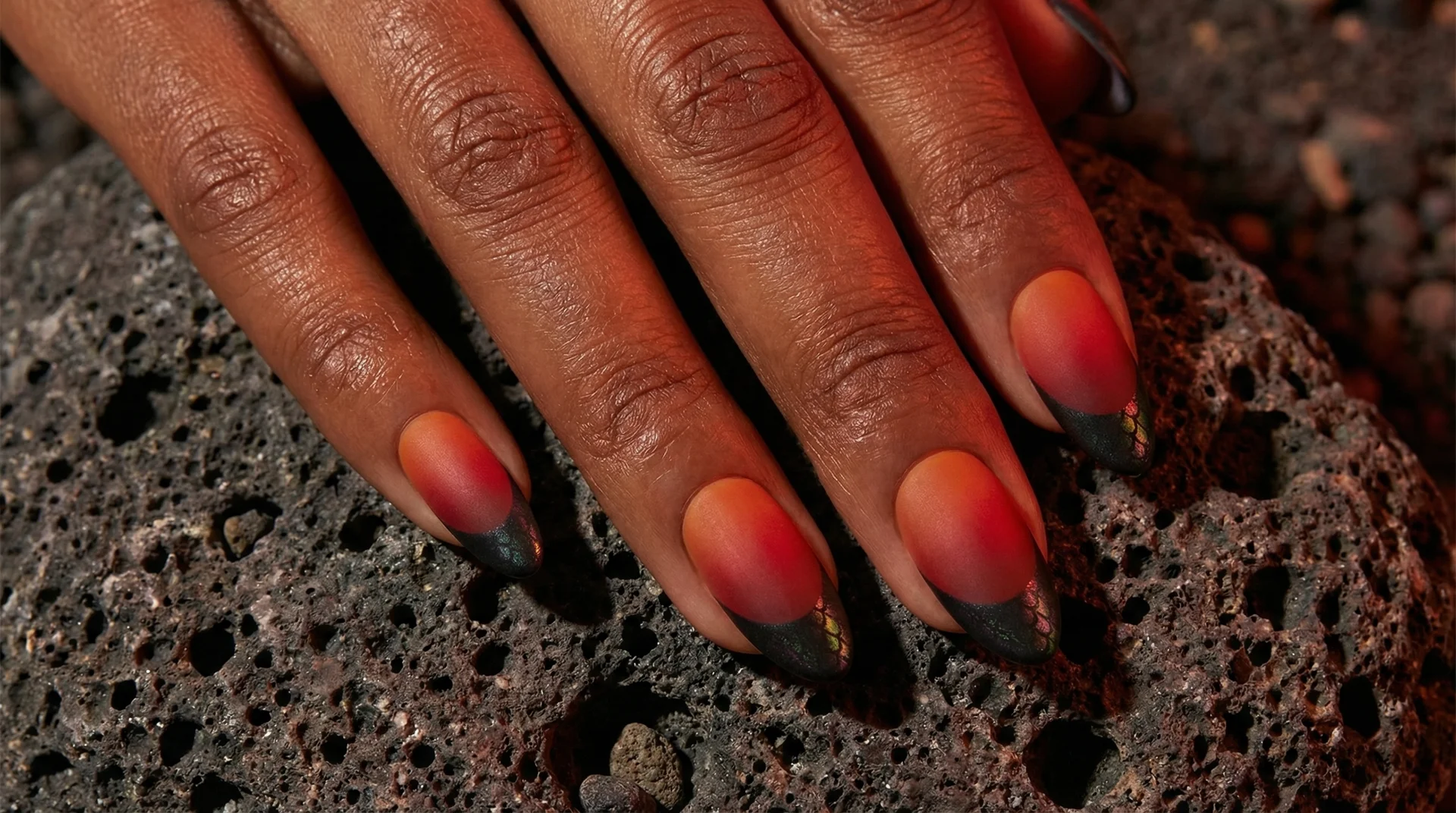 House of the Dragon inspired almond nails with ember red base and iridescent black french tip