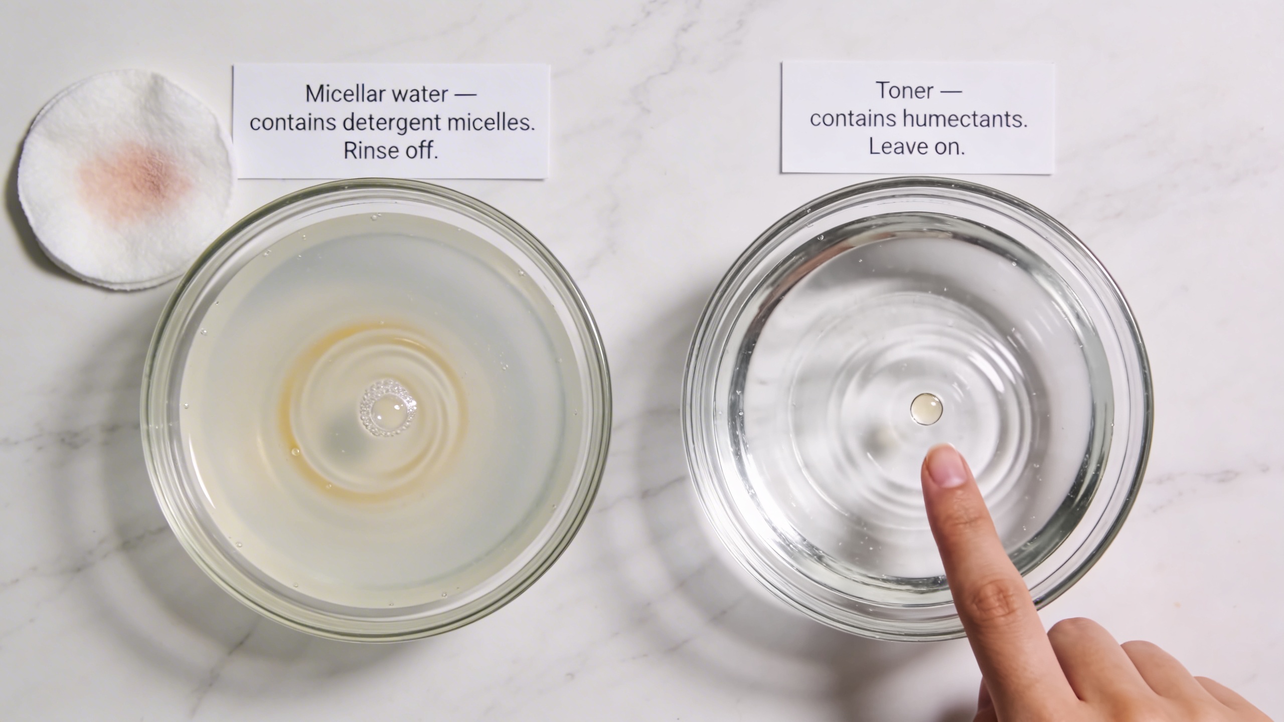 Two identical glass bowls — micellar water with a detergent swirl and used cotton pad beside