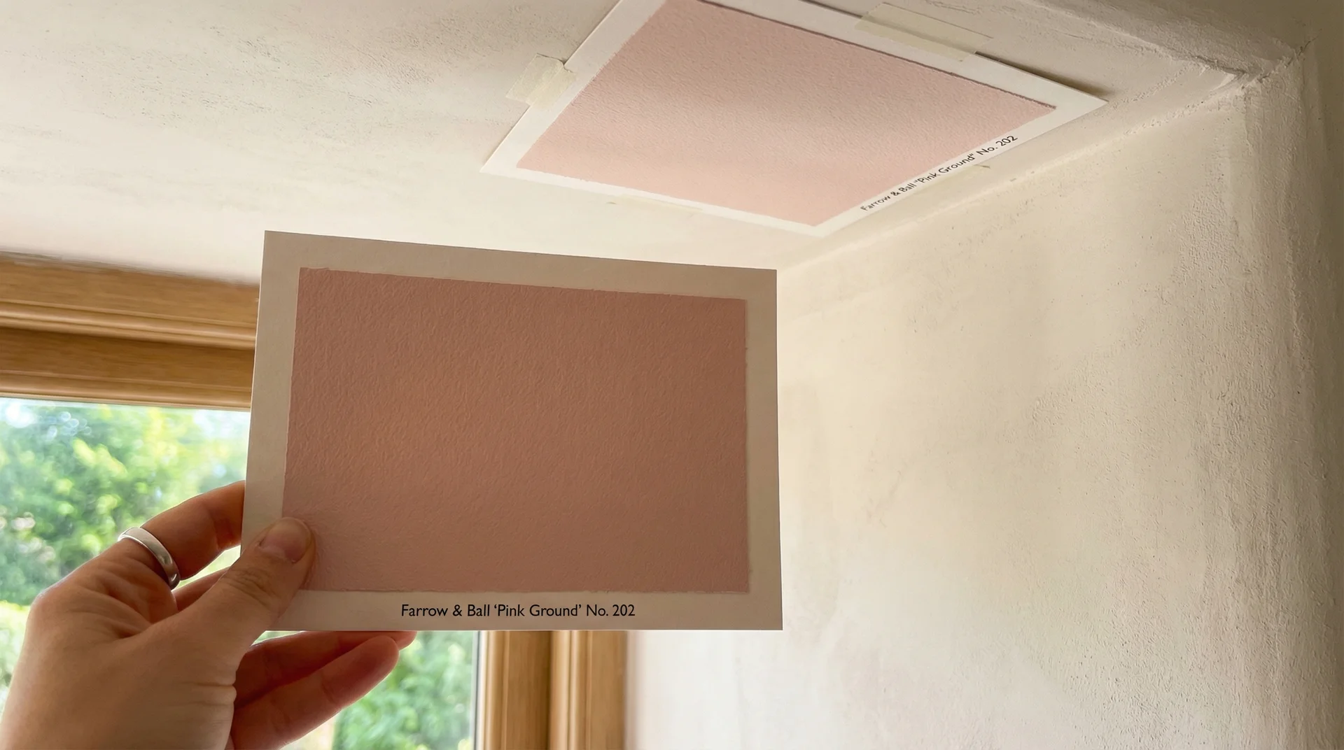 Two paint swatches in the same dusty blue showing flat matte vs satin eggshell finish and how light reflects differently