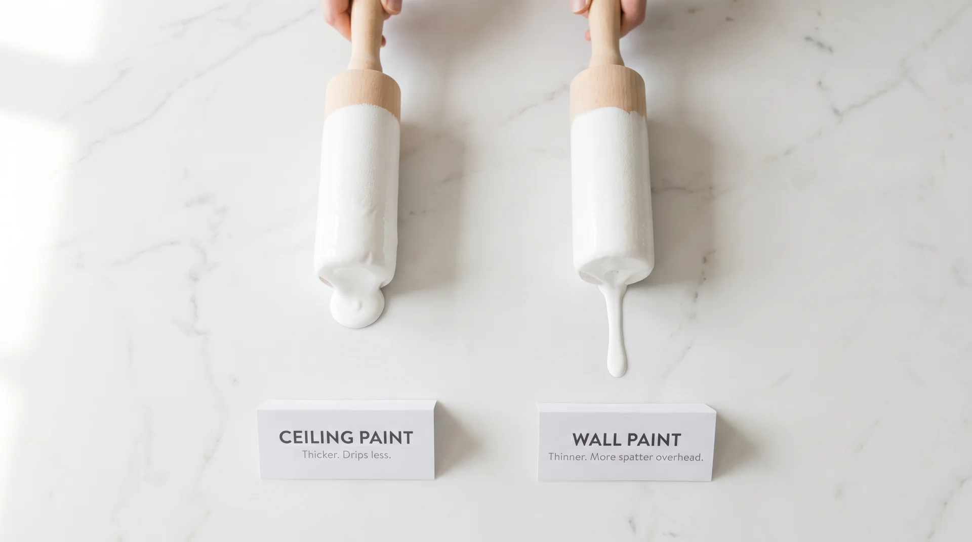 Two paint rollers side by side on marble showing thick ceiling paint drip left and thinner wall paint drip right