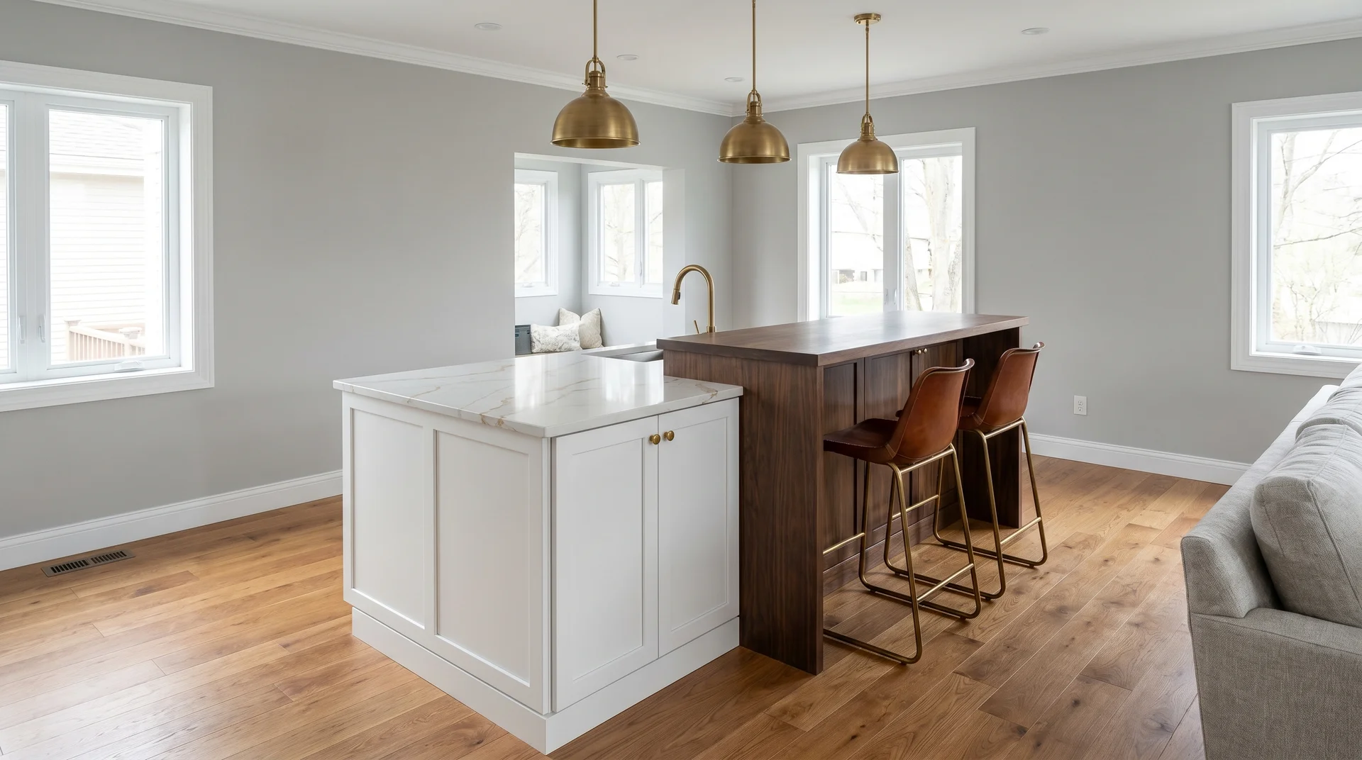 Two-tier kitchen island with a 36-inch prep surface and raised 42-inch bar section with bar stools in a modern kitchen
