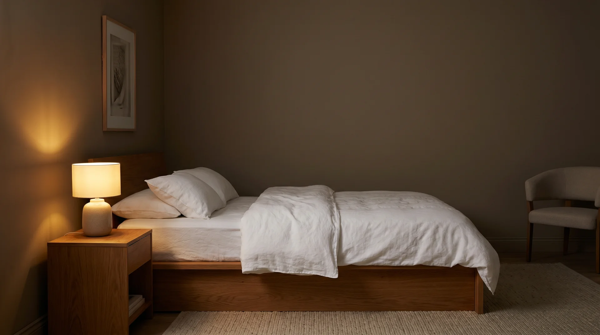 Bedroom painted Mink SW 6004 with warm bedside lighting showing how warm LED brings out the brown undertone